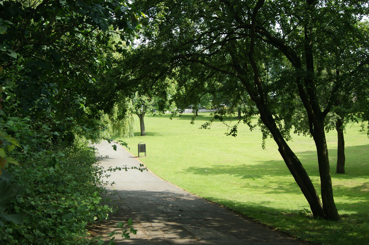 A path with a bin on the right.